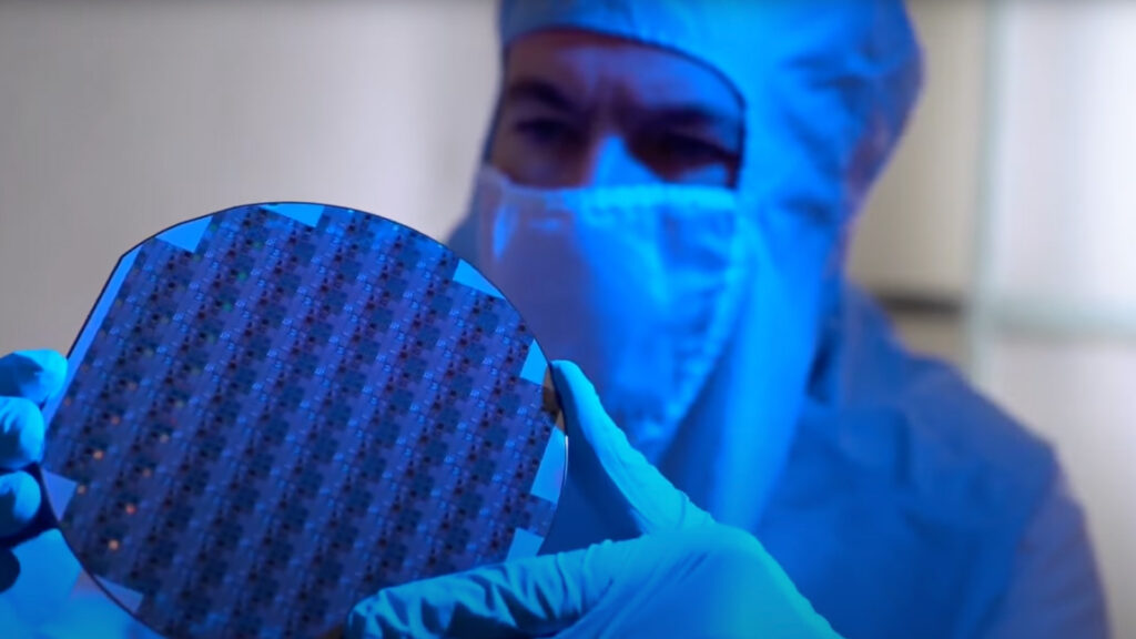 scientist holding microchip