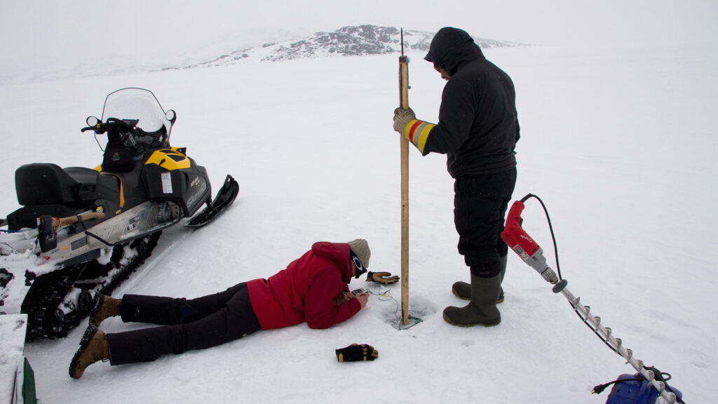 two men doing tests in the arctic